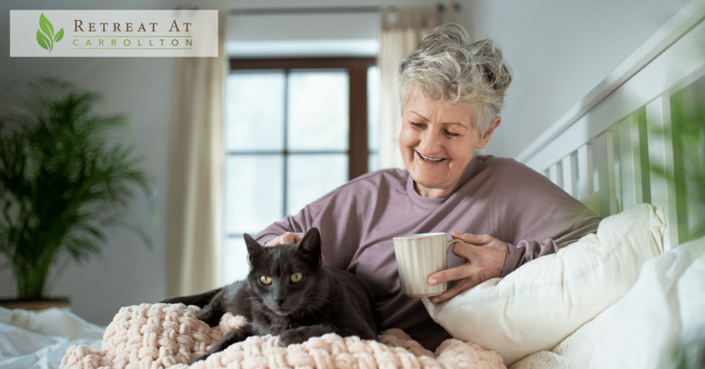 Pet-Friendly Assisted Living: a happy senior woman with a cat resting in bed.